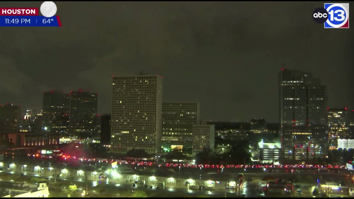 Clip from the Houston, Texas livecam just now as a big bolt of lightning hits a building.