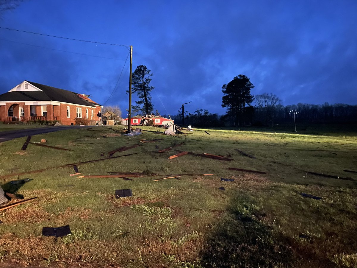 This is the scene in Bear Creek. Scattered debris, downed trees and down power lines. There is significant damage to this house and barn off of county route 65