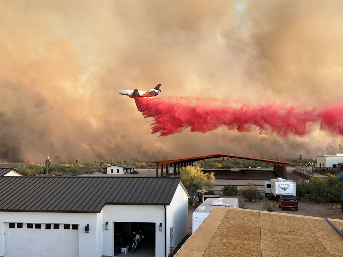 NOW DC-10 air tanker  dropping fire retardant on DiamondFire in far north Scottsdale,  view from Rio Verde Foothills