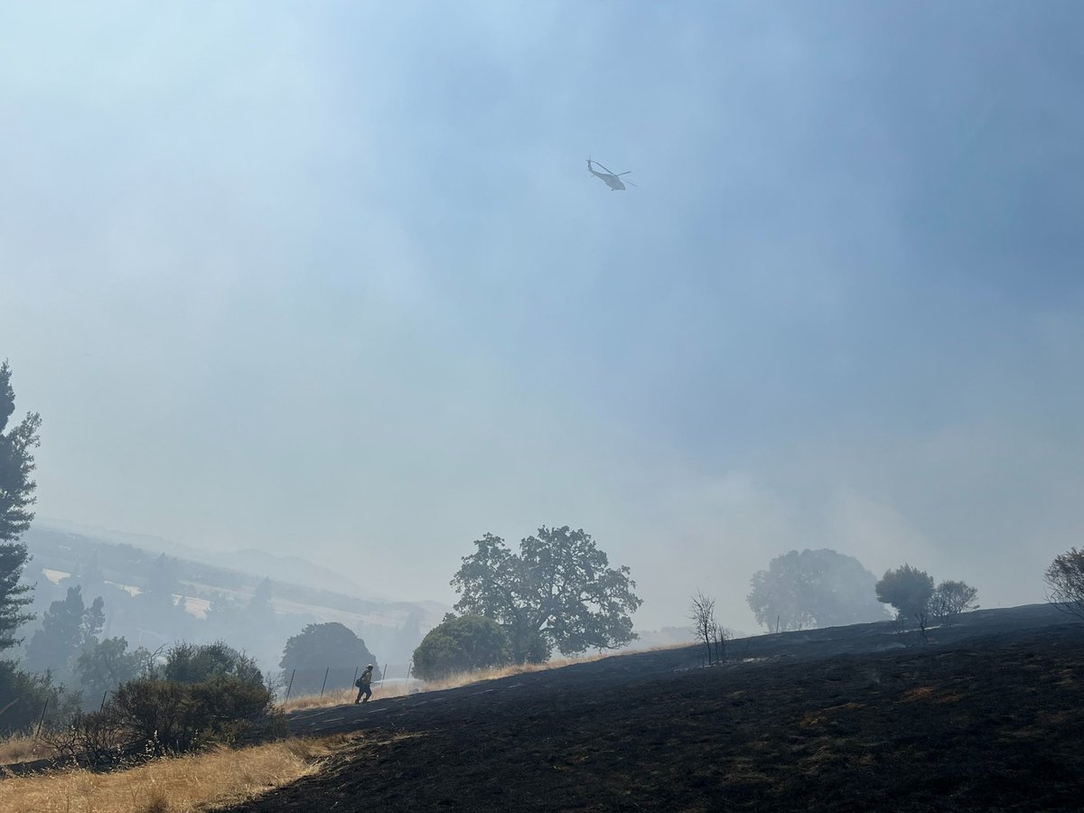 Firefighters have stopped the forward progress of a brush fire that triggered evacuation orders and warnings in the Green Valley area of Solano County, Cal Fire says.