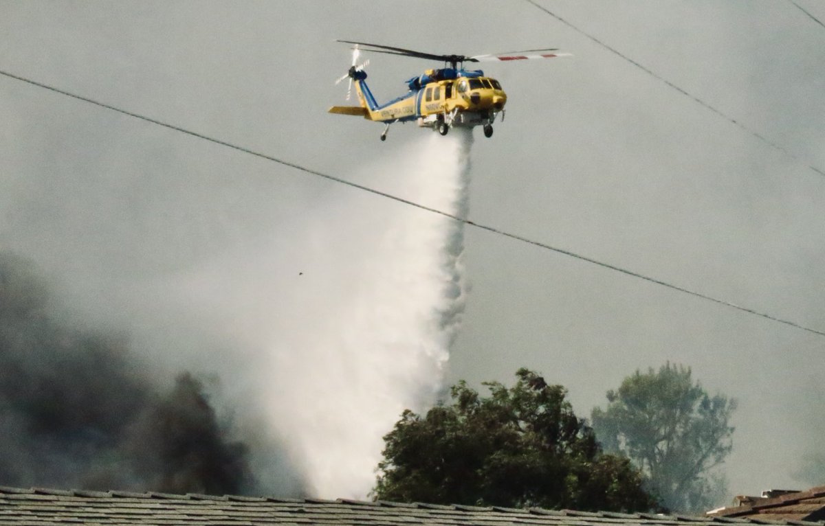 MountainFire 1500 plus acres in Ventura Cnty communities of Camarillo Springs & Somis. At least two possibly three major homes destroyed by fire others on hillsides threatened. Helicopters of limited use in fighting fire due to high winds and reduced visibility