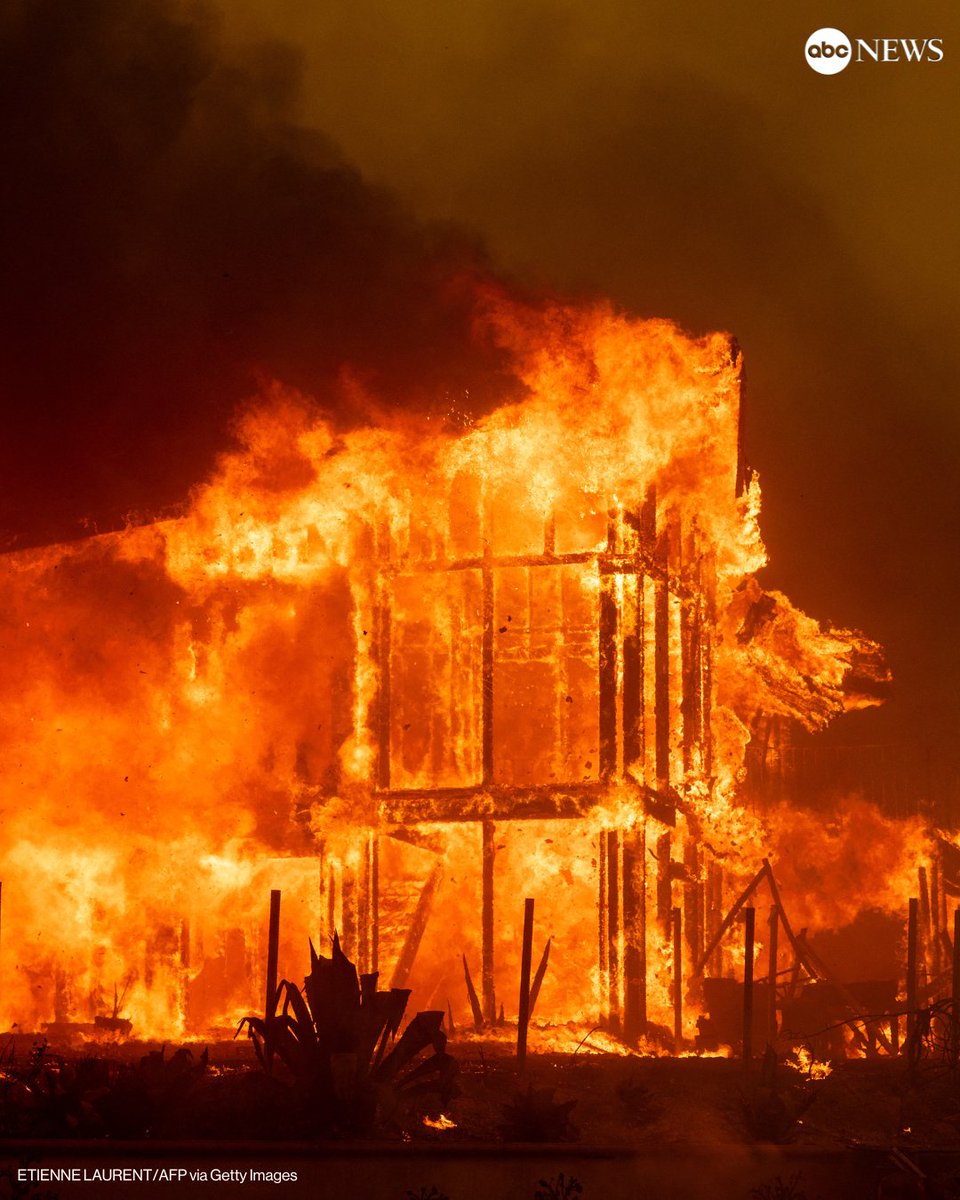 A house was engulfed in the flames of the Mountain Fire as the wildfire scorched acres in Camarillo Heights, California