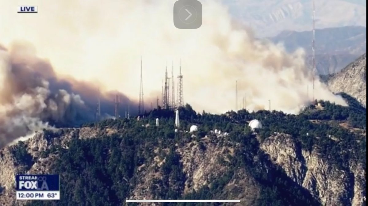 Stu_Mundel in Skyfox reports flames from the EatonFire are getting dangerously close to Mount Wilson, home to TV and radio antenna towers