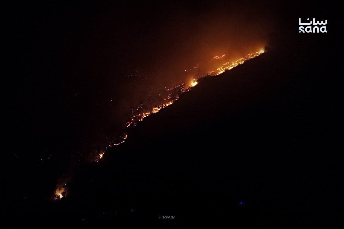 Civil defense teams continue their efforts to extinguish a fire that broke out in Jabal al-Turkman in the Latakia countryside.
